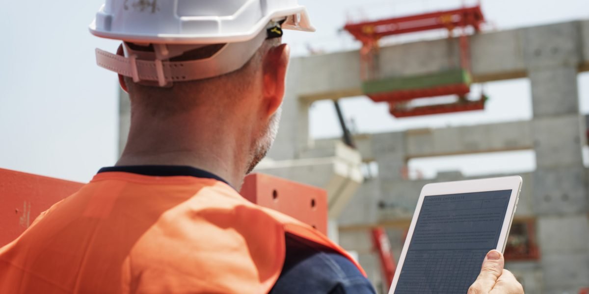 Construction worker working outdoors with the project